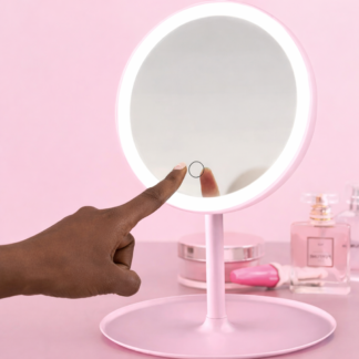 LED mirror in pink with a hand touching